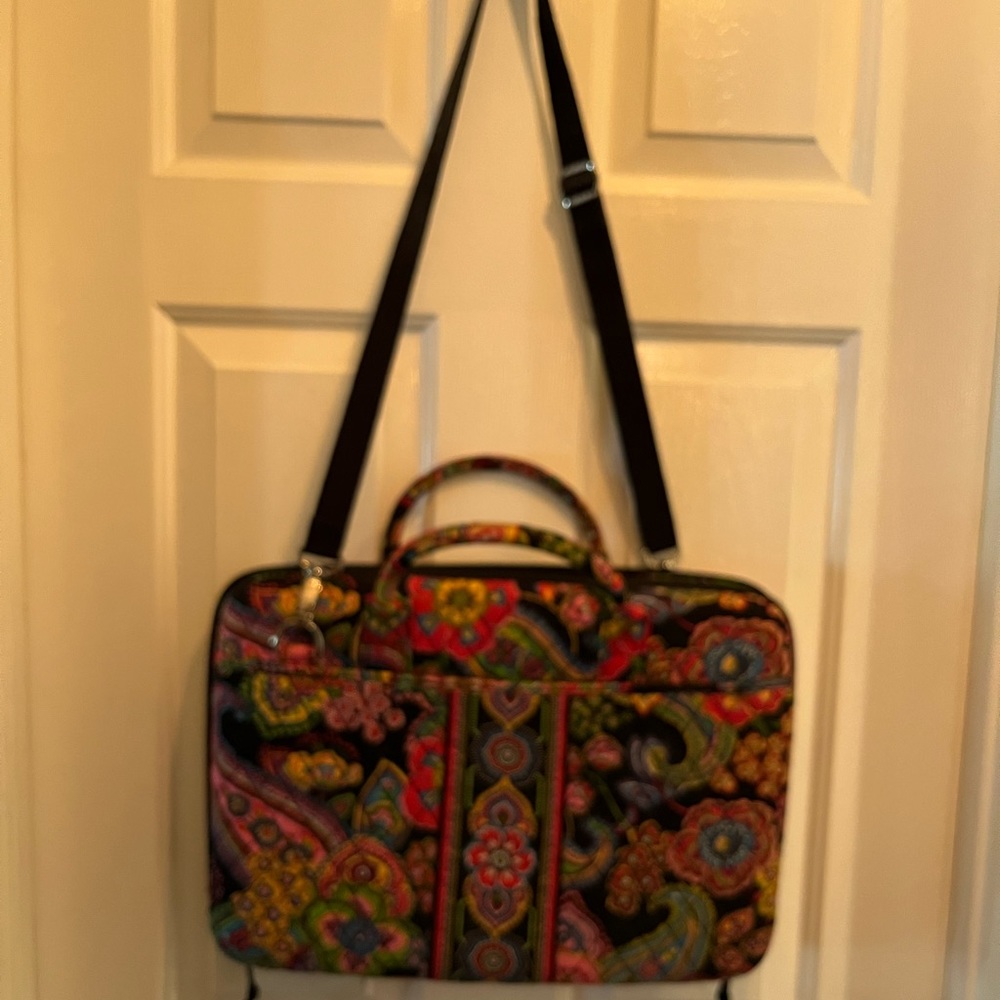 Vera Bradley hard shell laptop case with shoulder strap.